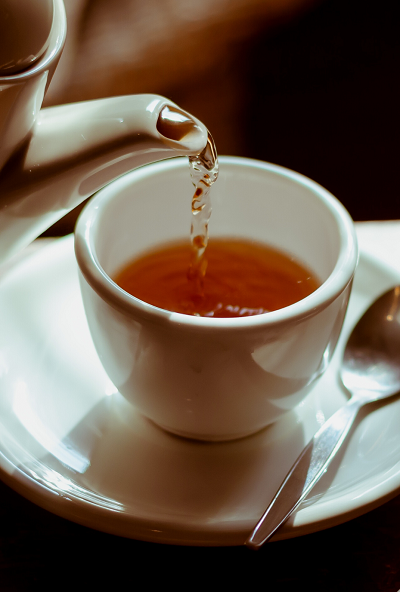 Beautiful black tea in white cup looking amazing